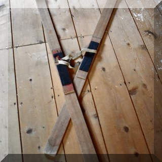 D68. Pair of decorative wooden skis. Water marks at one end. 48”l - $30 for the pair